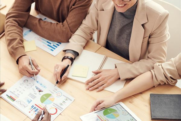 Browse Resources People work together at a table
